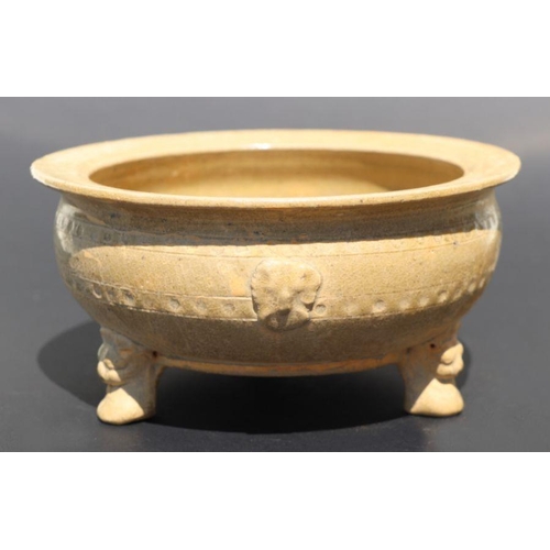 815 - A Chinese monochrome brown glaze tripod footed bowl with incised decoration, 20cm diameter.