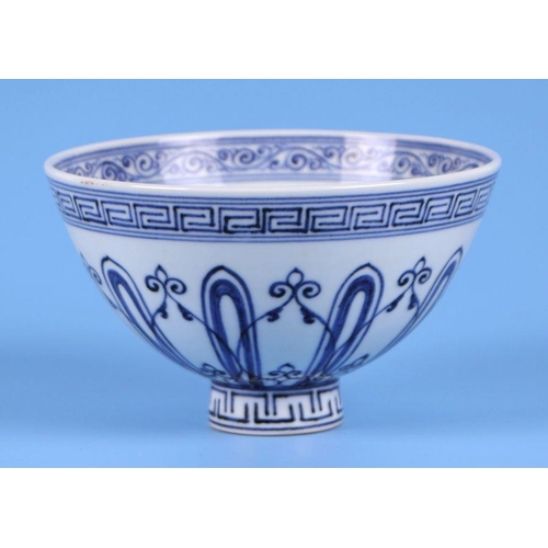 818 - A Chinese blue & white footed bowl, 9cms high.