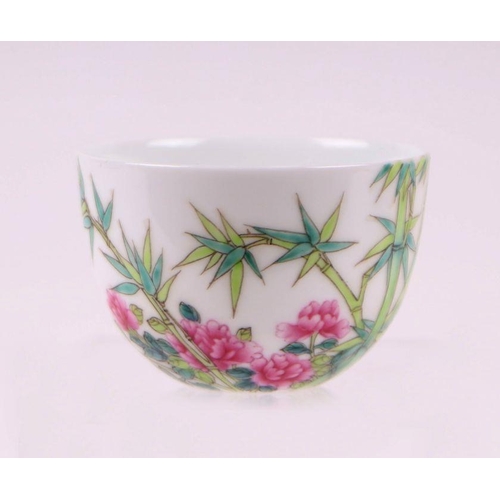 822 - A Chinese Republic style tea bowl decorated with flowers, bamboo and calligraphy, four character blu... 