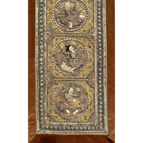 829 - A Burmese Kalaga sequin embroidered tapestry depicting dancing figures within roundels, 38cm by 126c... 