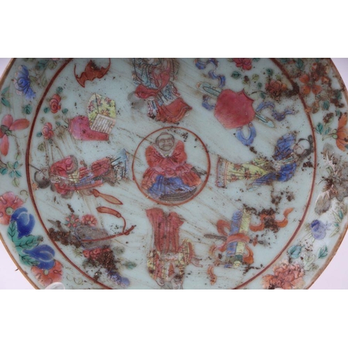 837 - A Chinese Canton Export famille rose plate decorated with figures and precious objects, on a celadon... 