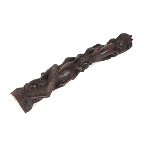 84 - An African tribal carved ebony fertility group of intertwined figures, 42cm high.