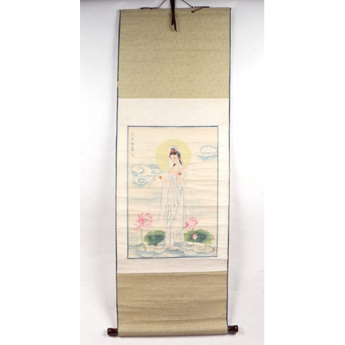 858 - A Chinese scroll painting depicting a bird amongst water lilies, 140cm high.