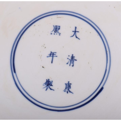 881 - A large Chinese blue and white shallow bowl decorated with flowering foliage, six character mark to ... 