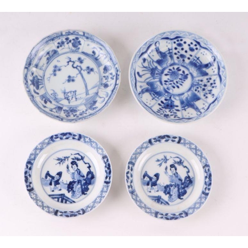 883 - A pair of Chinese blue and white dishes decorated with figures in a garden, four character blue mark... 