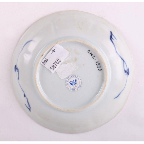 883 - A pair of Chinese blue and white dishes decorated with figures in a garden, four character blue mark... 