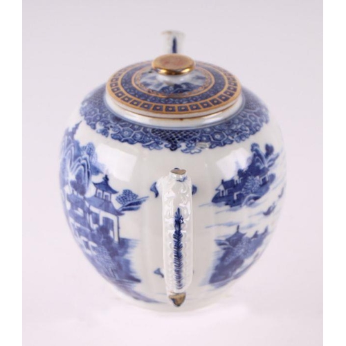 887 - A Chinese blue and white teapot decorated with a river landscape scene, 15cm high.