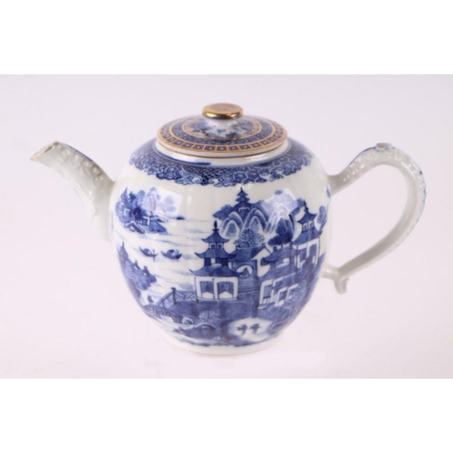 887 - A Chinese blue and white teapot decorated with a river landscape scene, 15cm high.