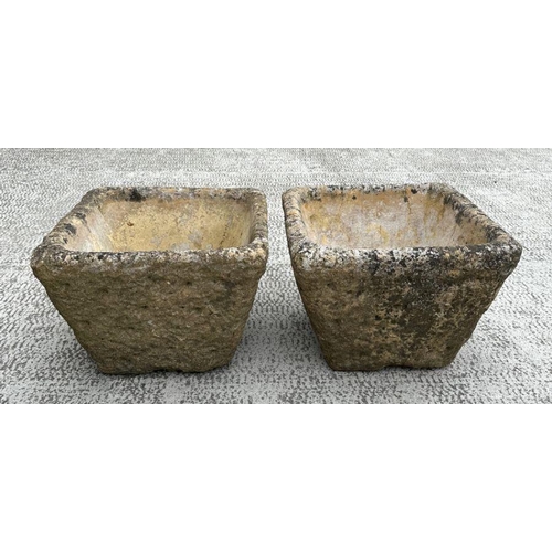 9 - A pair of reconstituted stone square planters, each 36cm wide (2).