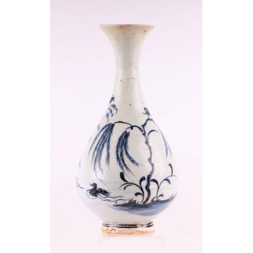 908 - A Chinese blue and white bottle vase decorated with birds and foliage, 25cm high.