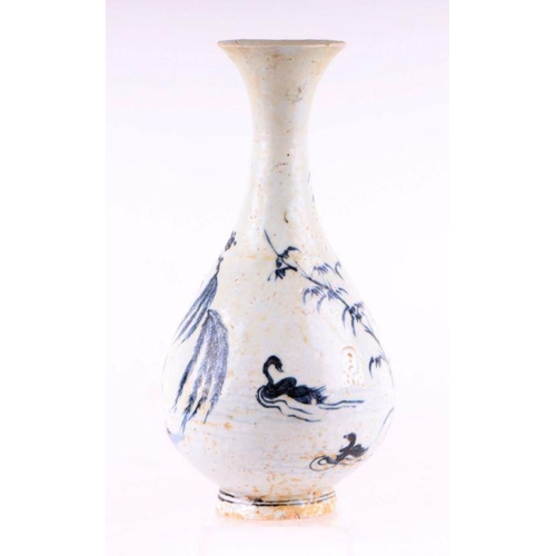 908 - A Chinese blue and white bottle vase decorated with birds and foliage, 25cm high.