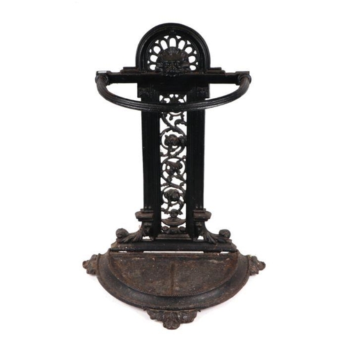 911 - A Victorian cast iron stick stand; together with a quantity of walking sticks and umbrellas to inclu... 