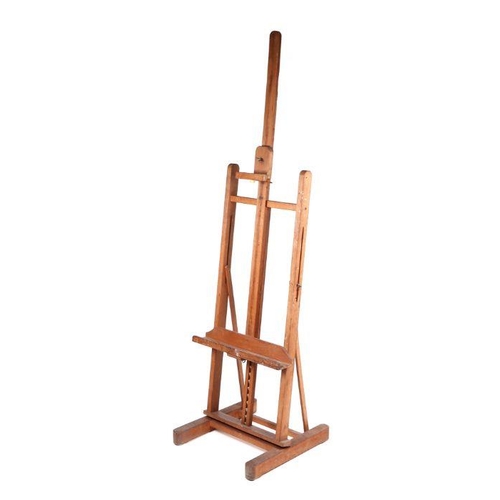 915 - A large adjustable artist's easel, 55cm wide.