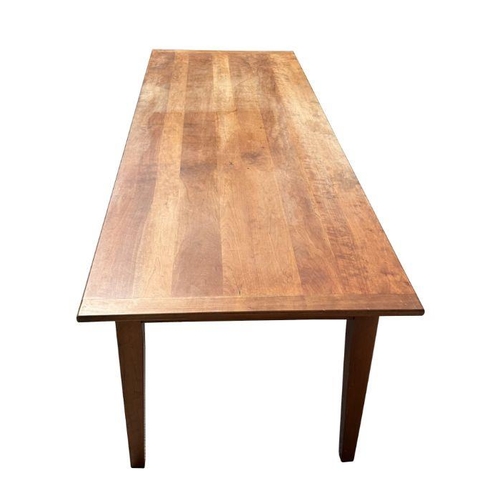 927 - A French cherrywood farmhouse table, the rectangular on tapering square legs, 86cm by 240cm long, wi... 