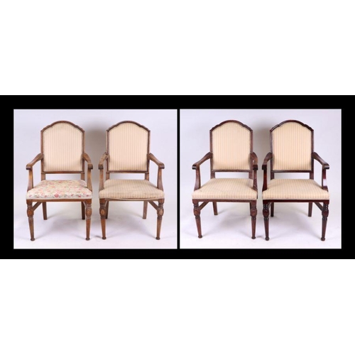 928 - A set of four beech elbow chairs with upholstered seats and backs (4).