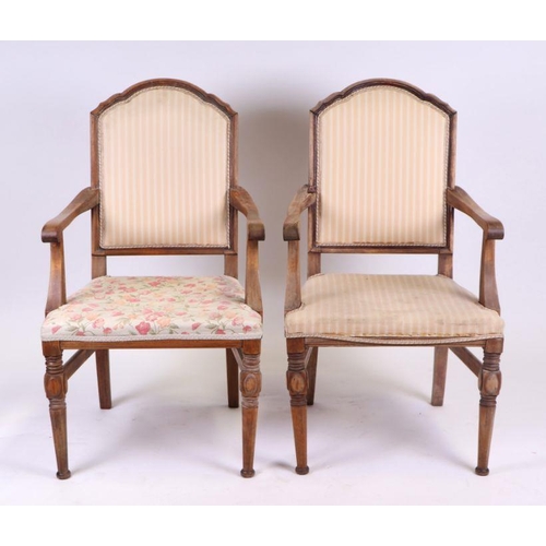 928 - A set of four beech elbow chairs with upholstered seats and backs (4).