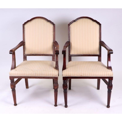 928 - A set of four beech elbow chairs with upholstered seats and backs (4).