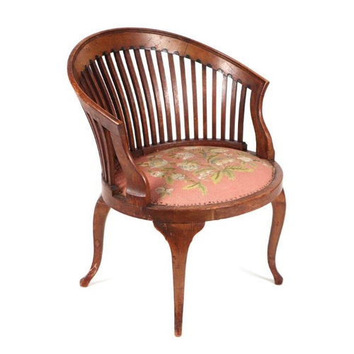 929 - An Edwardian mahogany slat back tub chair with upholstered seat.