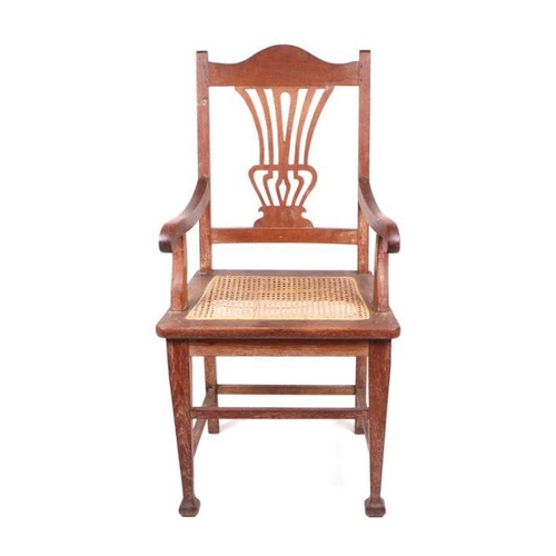 930 - An Arts and Crafts oak carver chair with caned seat; together with a Victorian dining chair and a be... 