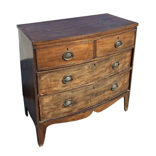 954 - A Regency mahogany bowfront chest of drawers of small proportion, with two short and two graduated l... 