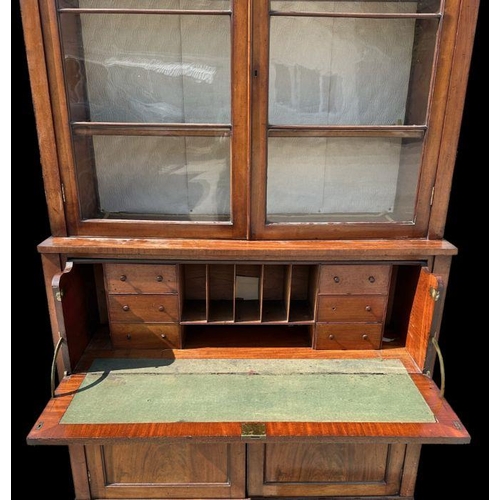 958 - A Victorian mahogany secretaire bookcase, the upper bookcase section with twin glazed drawers enclos... 