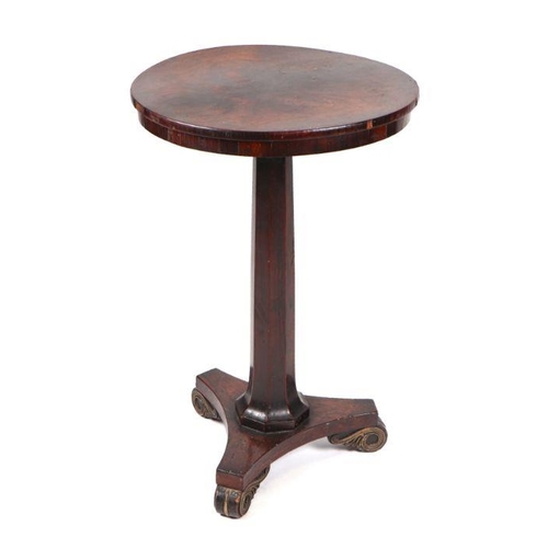 959 - A Victorian rosewood occasional table with circular top and octagonal tapering column, on a triform ... 