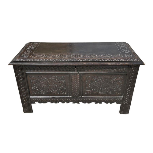 966 - A Victorian Edwards & Roberts 17th century style oak coffer with candle box and carved decoratio... 