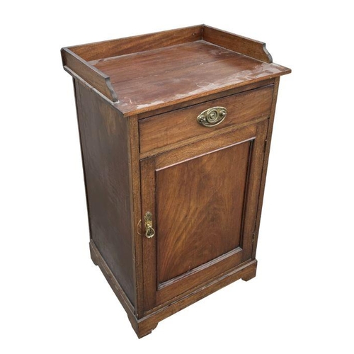 971 - A 19th century mahogany pot cupboard with three-quarter gallery above a single drawer and panelled d... 