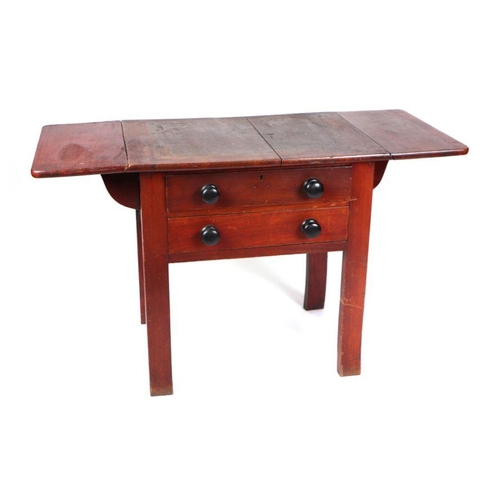 975 - A 19th century stained pine dairy table, the rectangular top with drop flaps above two drawers with ... 