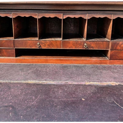 976 - A 19th century mahogany secretaire chest, the secretaire section opening to reveal a fitted interior... 