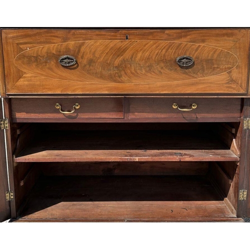 976 - A 19th century mahogany secretaire chest, the secretaire section opening to reveal a fitted interior... 