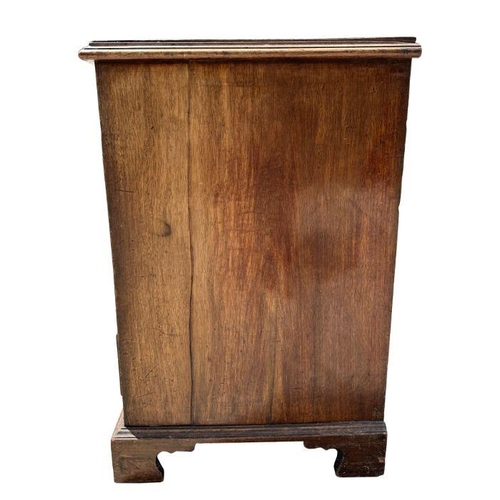 984 - A George III mahogany chest of four graduated long drawers, on bracket feet, 94cm wide.