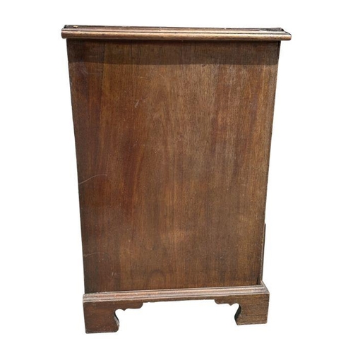 984 - A George III mahogany chest of four graduated long drawers, on bracket feet, 94cm wide.