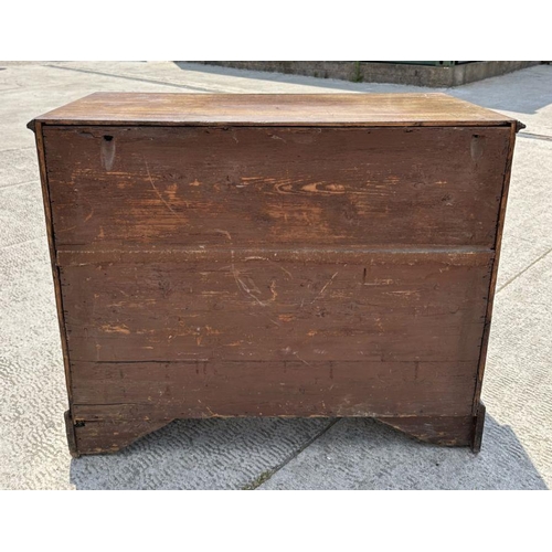 985 - A 19th century mahogany kneehole desk, the central cupboard flanked by an arrangement of seven drawe... 