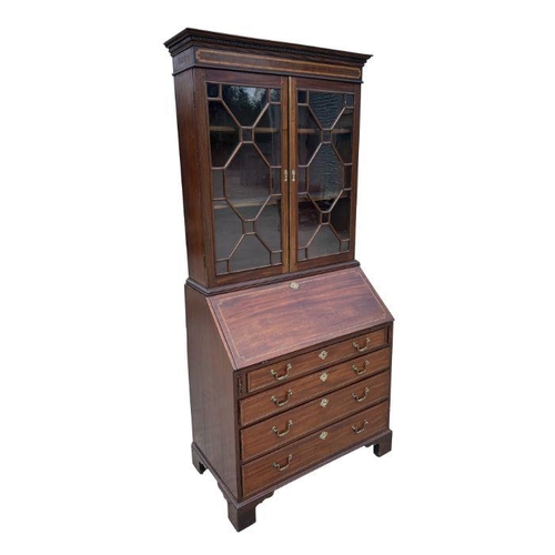 987 - A late 19th century mahogany bureau bookcase, the upper section with twin astragal glazed doors encl... 