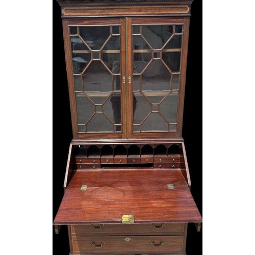 987 - A late 19th century mahogany bureau bookcase, the upper section with twin astragal glazed doors encl... 