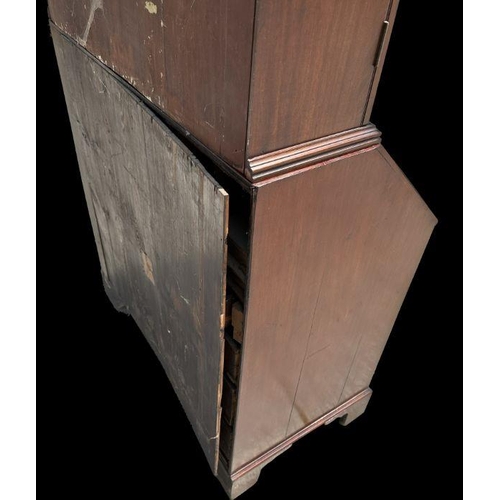 987 - A late 19th century mahogany bureau bookcase, the upper section with twin astragal glazed doors encl... 