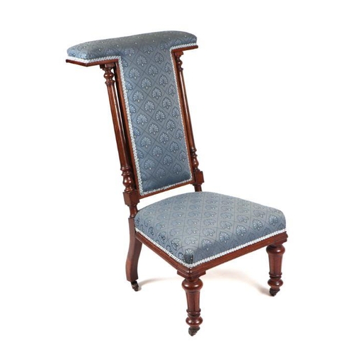 997 - A 19th century walnut prie-dieu chair.