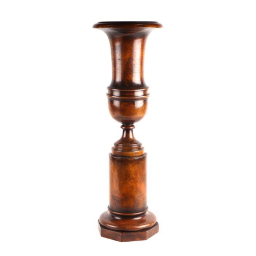 999 - A large turned walnut vase on stand, 74cm high.