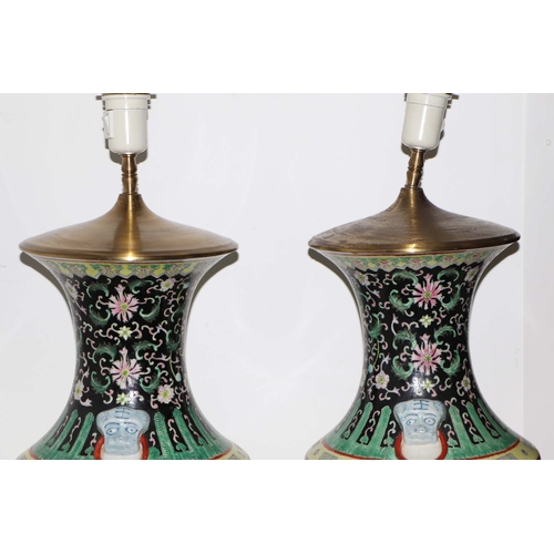 898 - A pair of Chinese famille vert vase table lamps decorated with dragons amongst waves; six character ... 