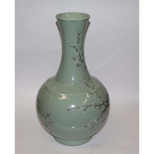 894 - A large Chinese celadon ground vase decorated with flowering prunus with six character black mark to... 