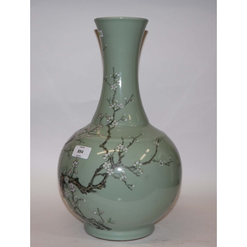 894 - A large Chinese celadon ground vase decorated with flowering prunus with six character black mark to... 