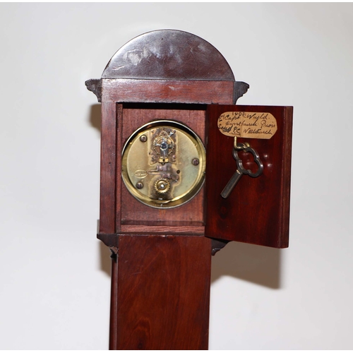 624 - A late 19th / early 20th century mahogany cased miniature longcase clock, the white enamel dial with... 