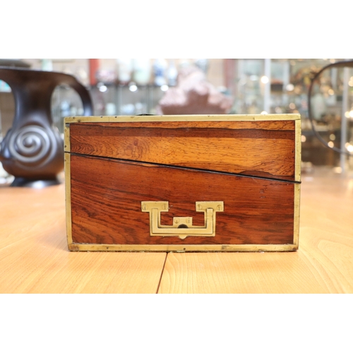 513 - A Regency mahogany writing slope with brass inlay decoration, 36cms wide.