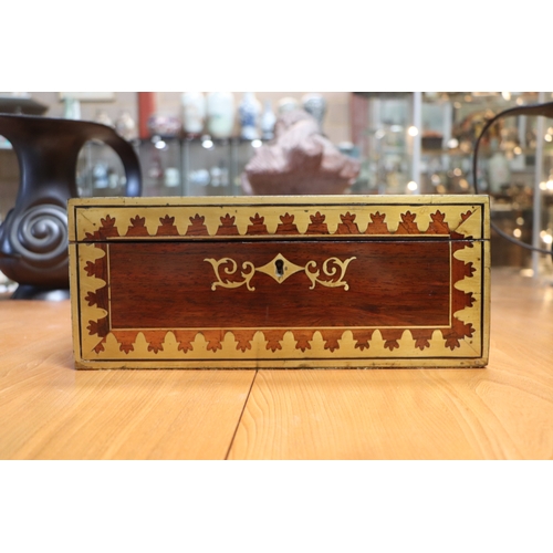 513 - A Regency mahogany writing slope with brass inlay decoration, 36cms wide.