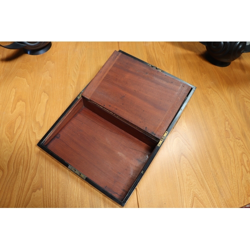 513 - A Regency mahogany writing slope with brass inlay decoration, 36cms wide.