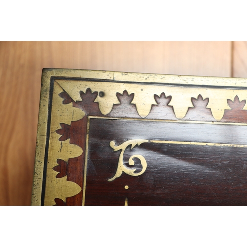 513 - A Regency mahogany writing slope with brass inlay decoration, 36cms wide.