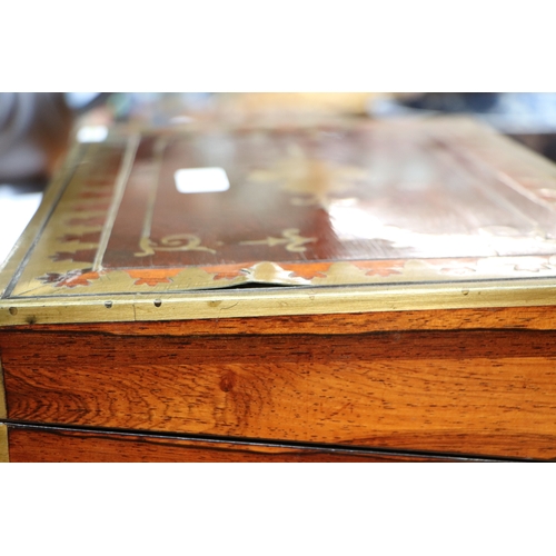 513 - A Regency mahogany writing slope with brass inlay decoration, 36cms wide.