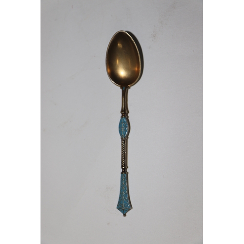 688 - A set of six continental silver gilt and enamel teaspoons, 75g (6).