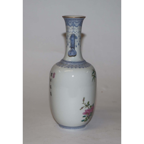 760 - A Chinese republic style famille rose two-handled vase decorated with bamboo and roses, four charact... 